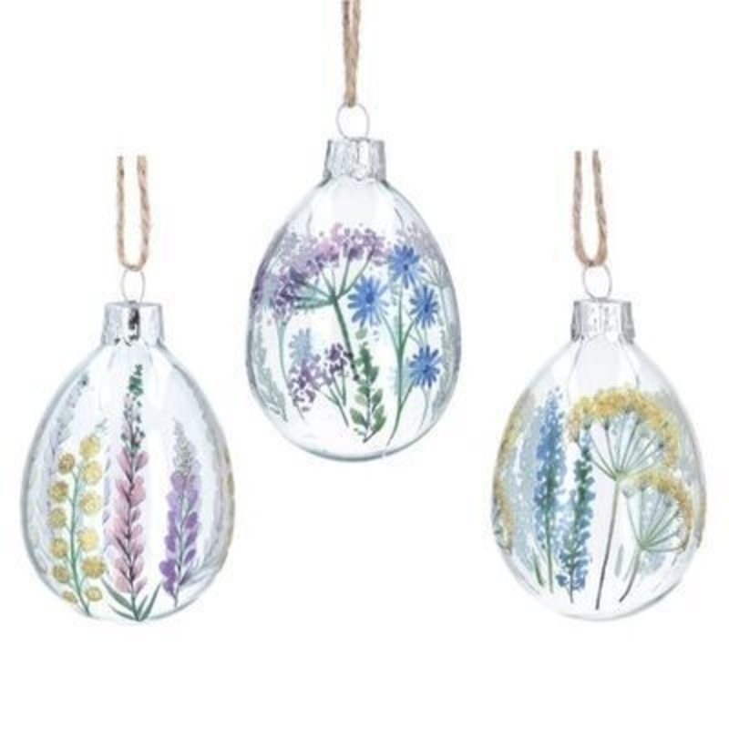 Egg shaped hanging glass decoration with yellow blue and purple floral spring meadow detail. The perfect addition to your home for Easter and spring. By Gisela Graham.